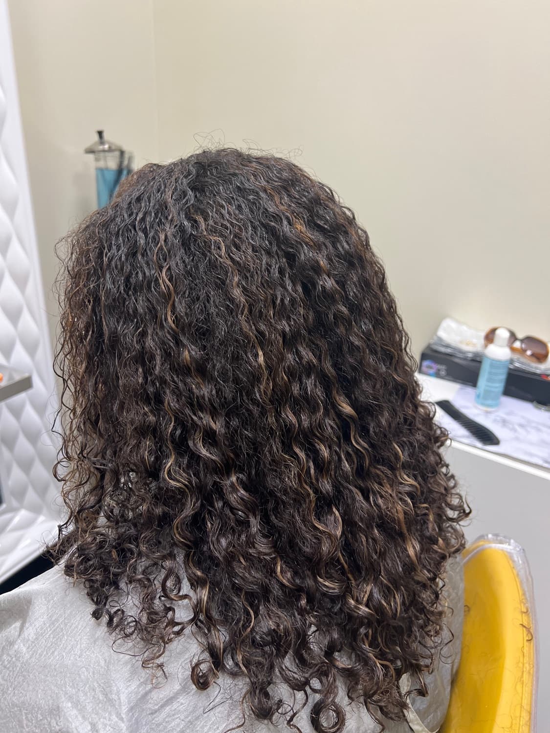 Defined, springy curls shaped with a dry curly cut at Nofa Salon